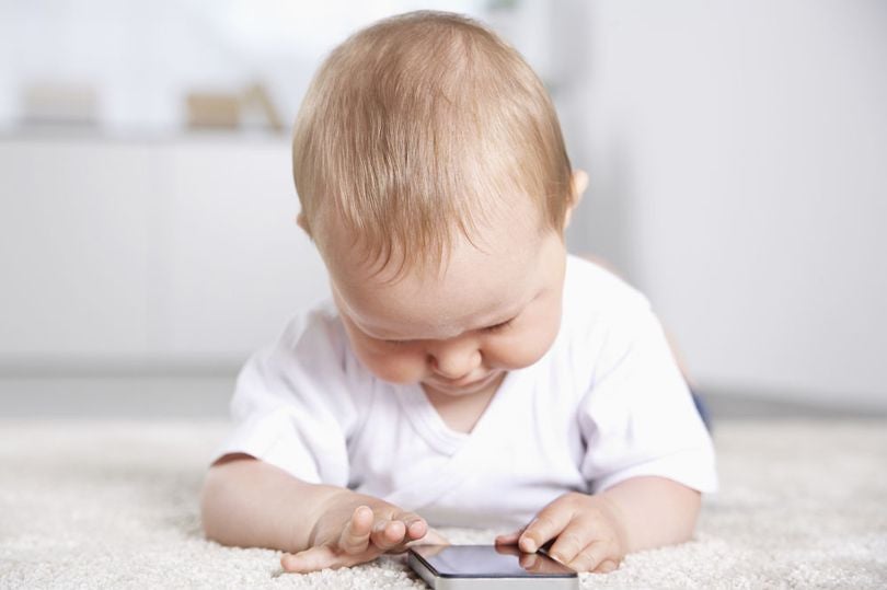 Baby Girl Playing With Mobile Phone