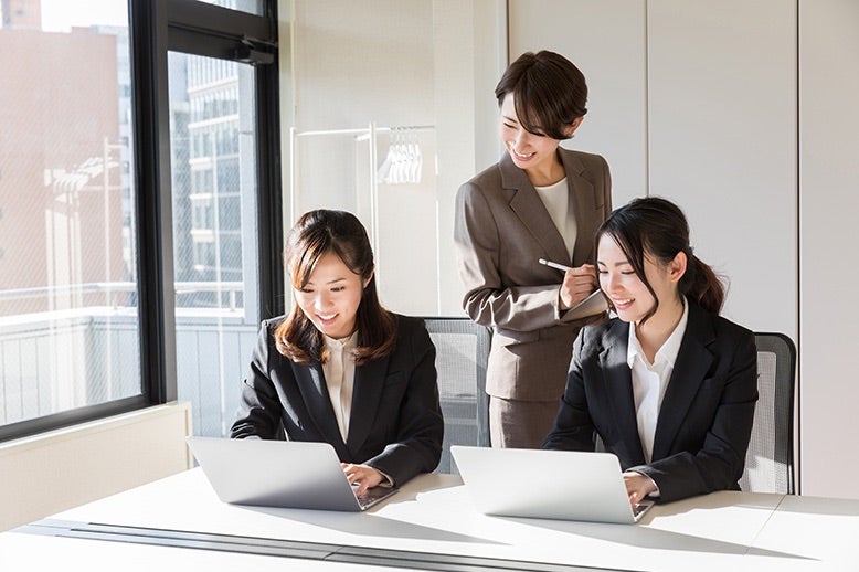 Three Businesswomen Working In Office In Page