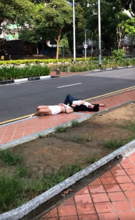 man finds couple passed out by the roadside theyre so drunk that his shouts couldnt wake them up world of buzz