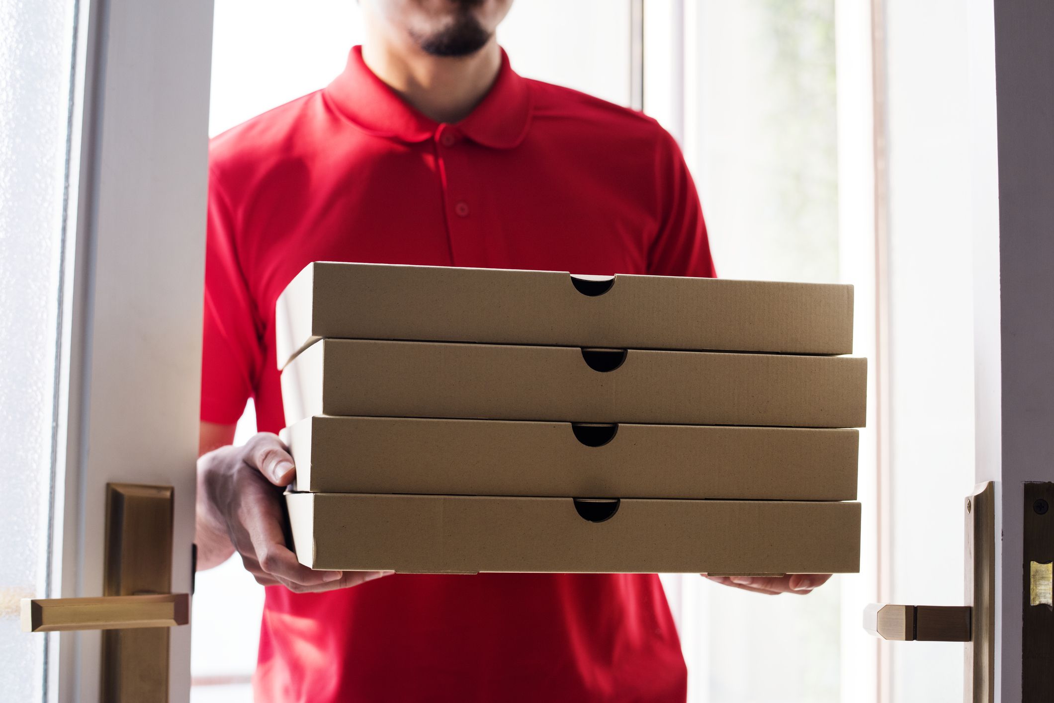 man delivery pizza to customer royalty free image 929918572 1564425986