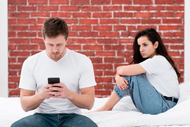 Man Checking His Phone While His Girlfriend Is Angry 23 2148397676