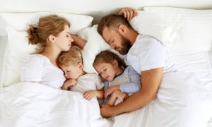 Healthy Sleep. Happy Family Parents And Children Sleeping In White Bed 1184108281 1325X795