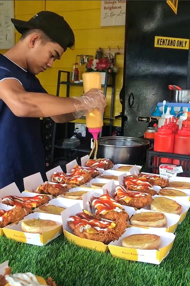 Boy Making Burger Delicious