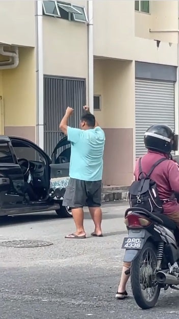 malaysian man clubbing on the road 2