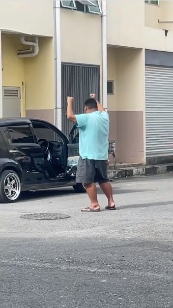 Malaysian Man Clubbing On The Road