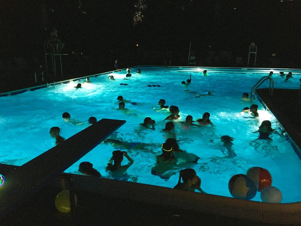 Crowded Swimming Pool At Night