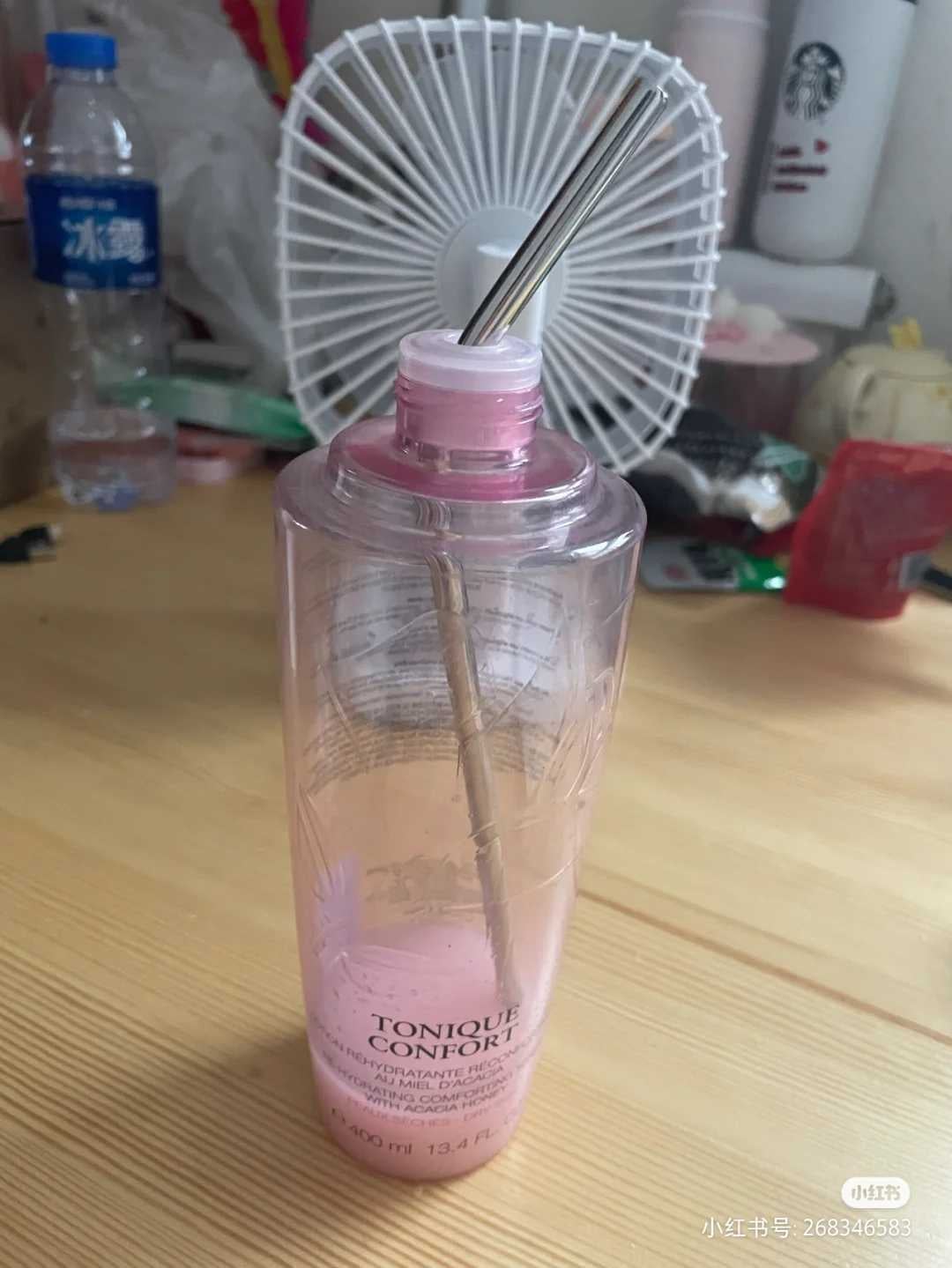 Lancome toner with a straw in it