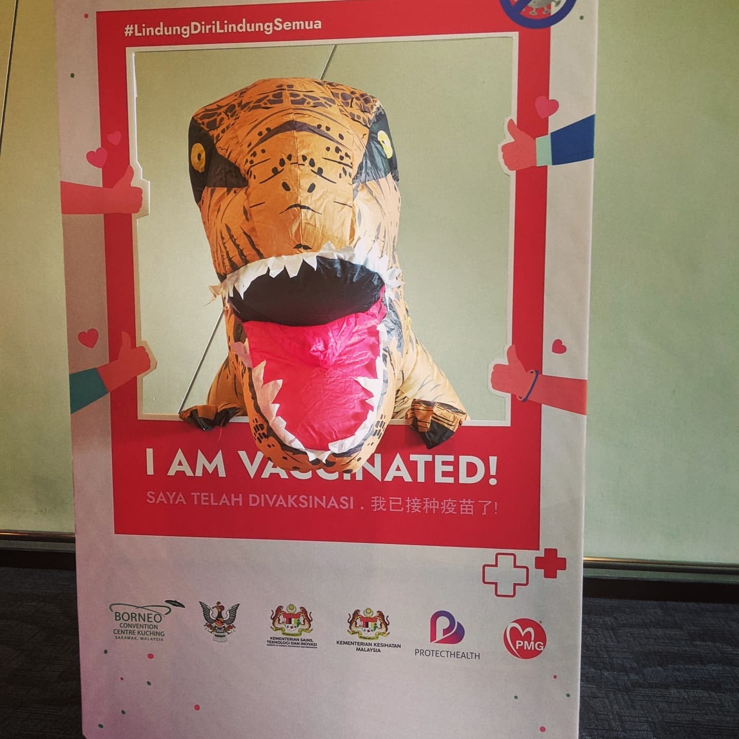 Man in dinosaur suit in Sarawak vaccination center 5