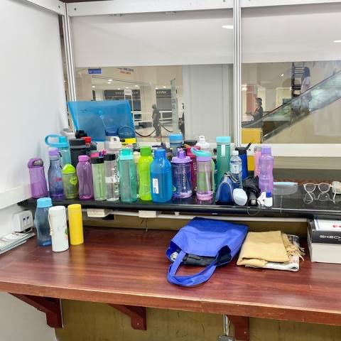 Tupperware water bottle collection at lost and found counter in WTV kl vaccination centre 2