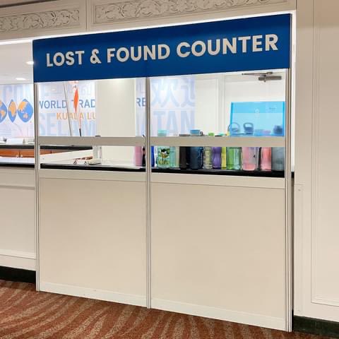 Tupperware water bottle collection at lost and found counter in WTV kl vaccination centre