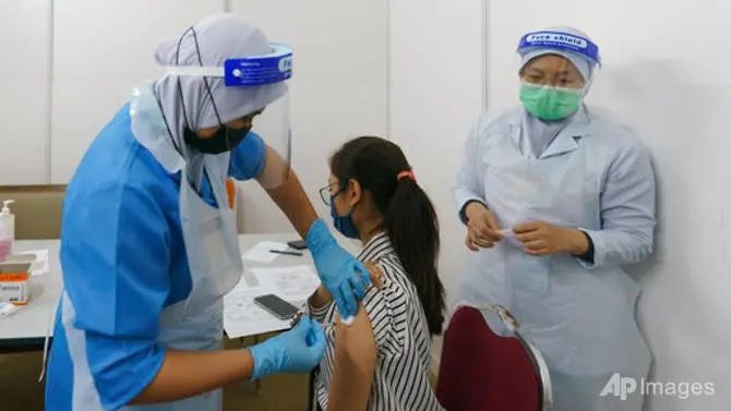 Woman Taking Vacciantion In Malaysia