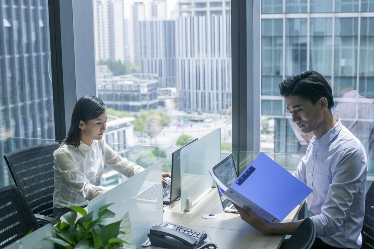 Man And Woman Working In The Office