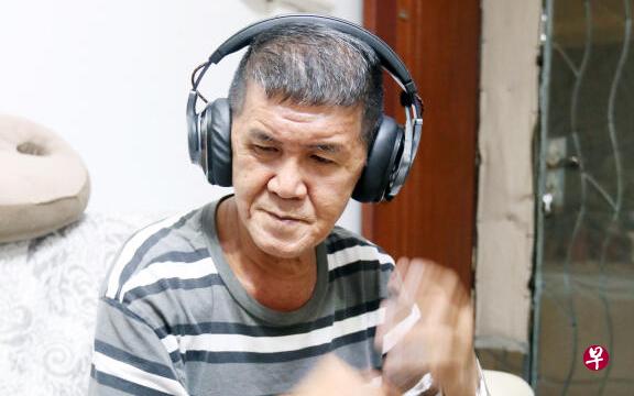 Man wears earphone to sleep because neighbours upstairs is too loud