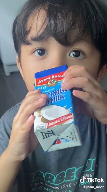 SS 1 kid boy drinking coconut milk