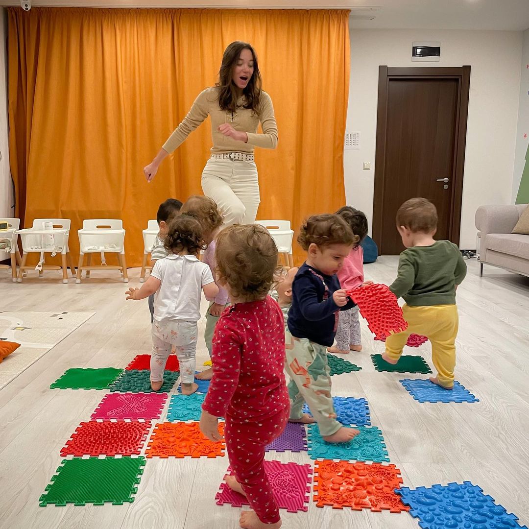 kristina playing with babies