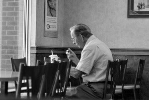 man eating alone