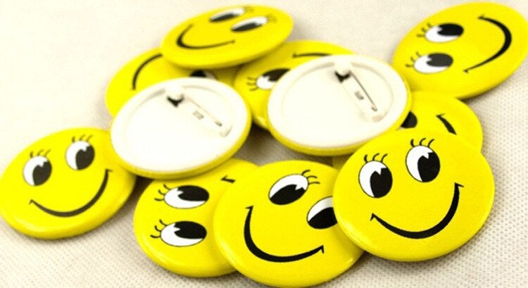 smiley face badge