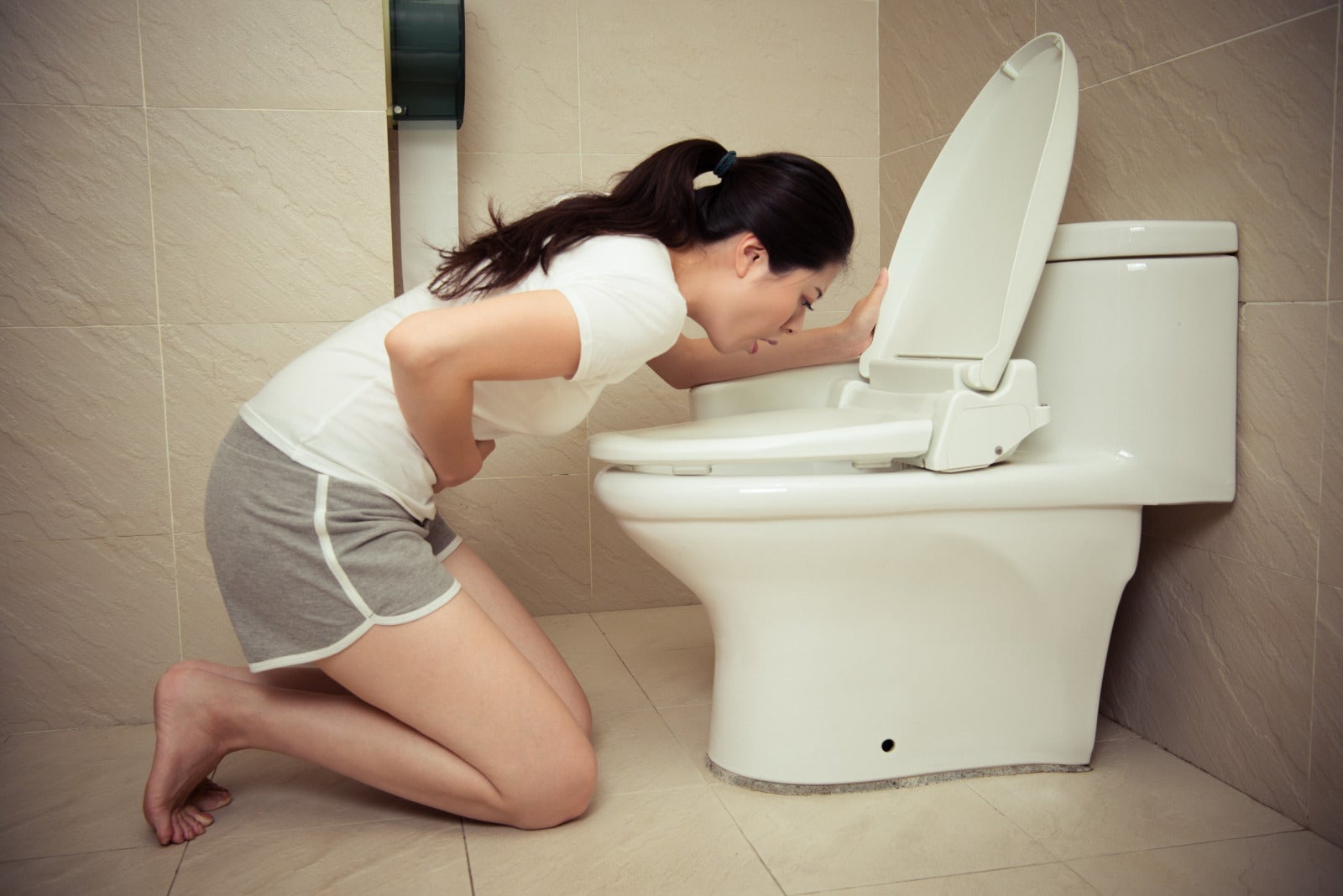 woman toilet bowl vomit