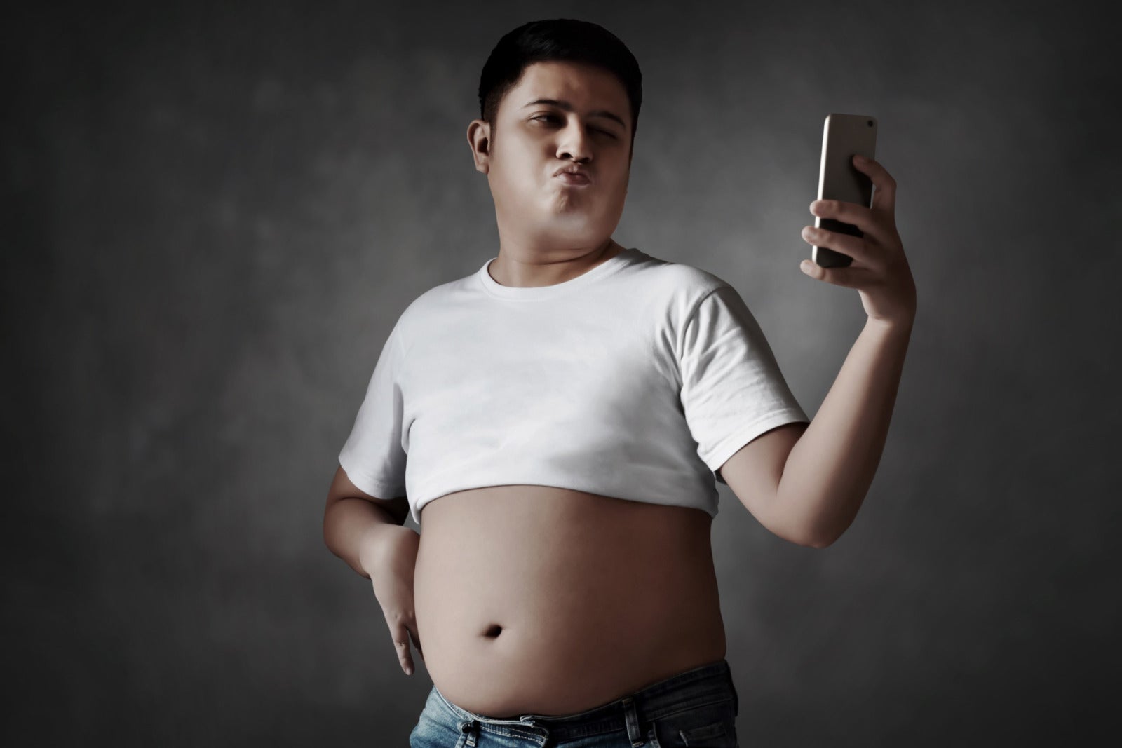 man holding phone happy fat belly stomach