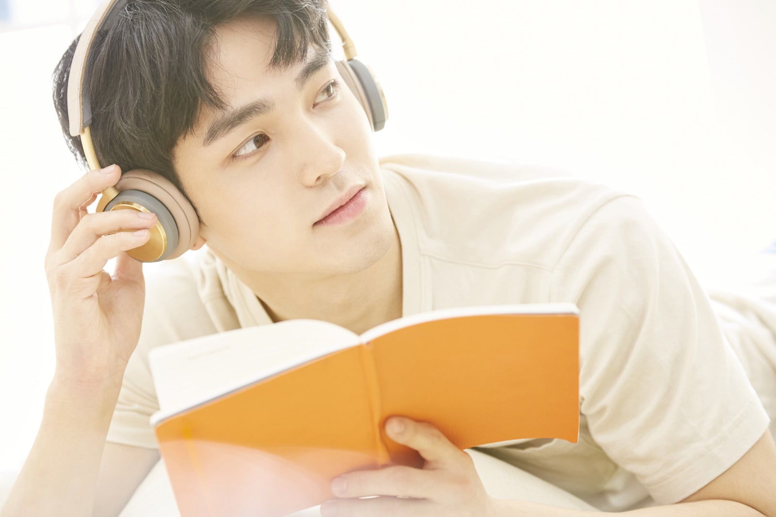 Man Listening To Song Headphone Reading