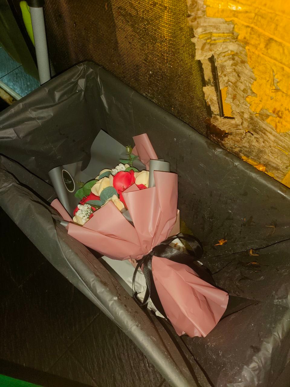 Valentines day roses flower in the beer factory rubbish bin