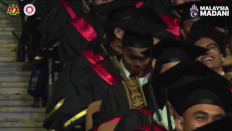 SS 6 Guy graduation smile in hall screen