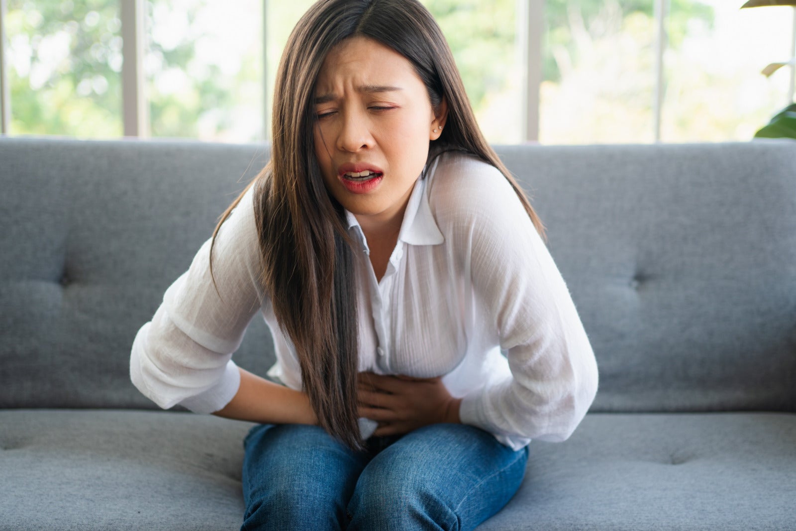 Woman Menstrual Pain Stomach Cramp Sitting Sofa