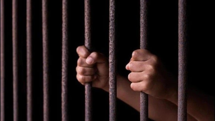 jail behind bars man
