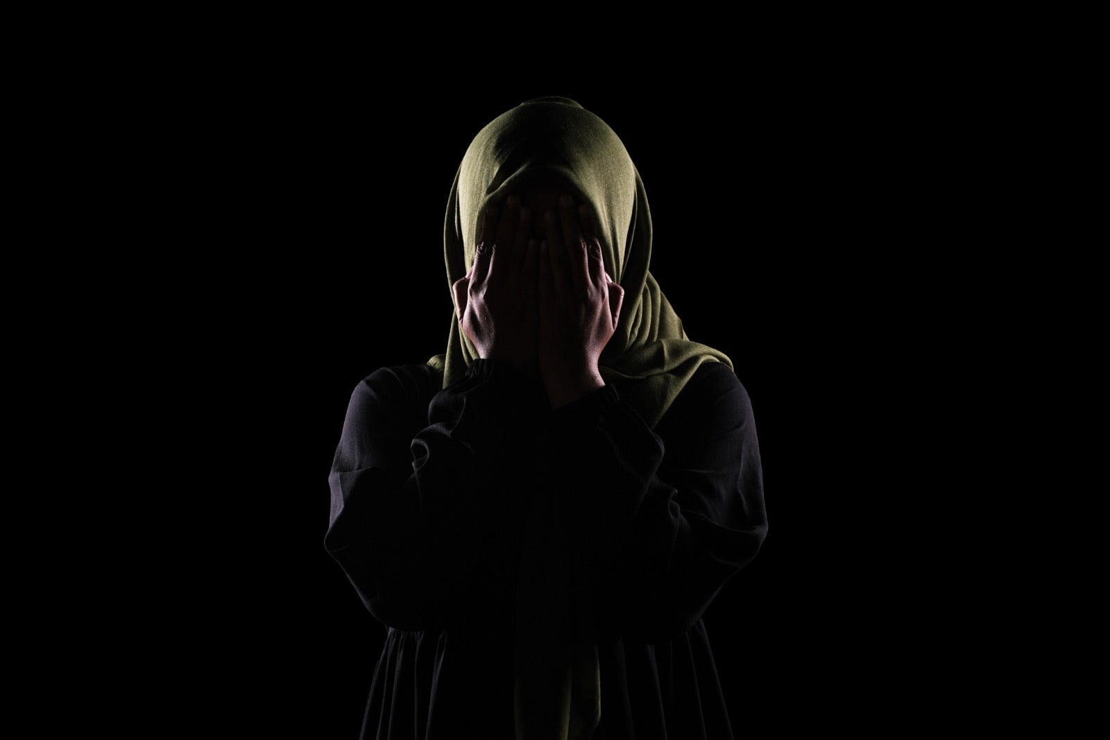 muslim woman young cover face scared dark