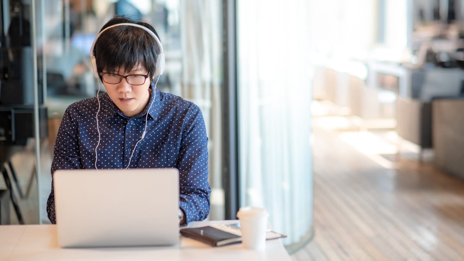 123rf man wearing earphone laptop using working asian