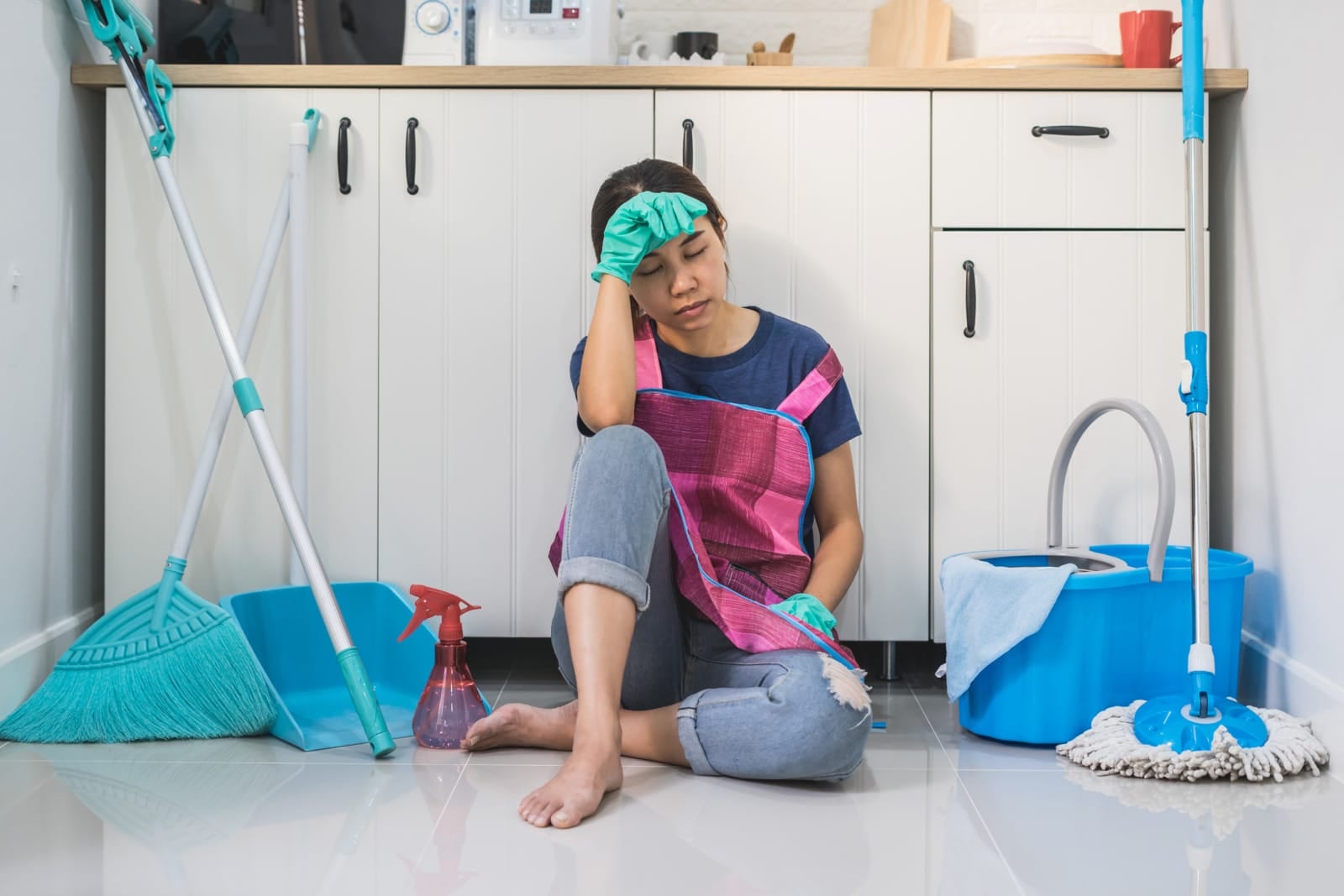 123rf tired housewife sitting on floor stressed resting kitchen