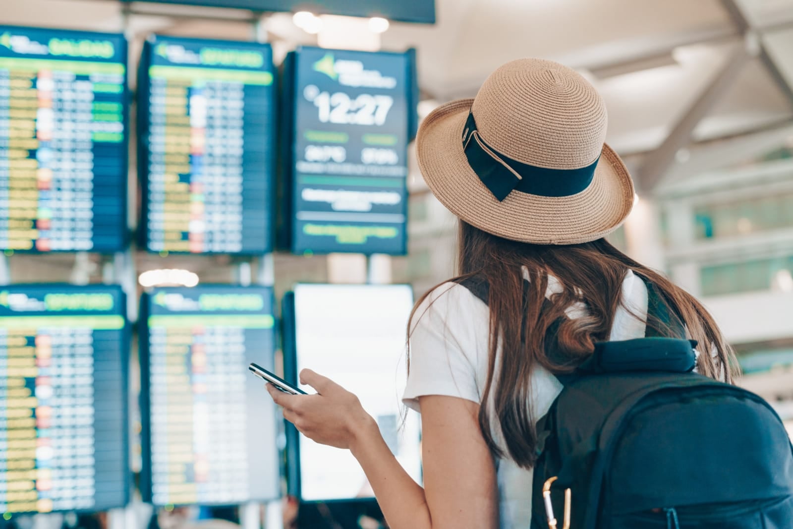 123Rf Woman Airport Tourist Scoreboard With Backpack Hat