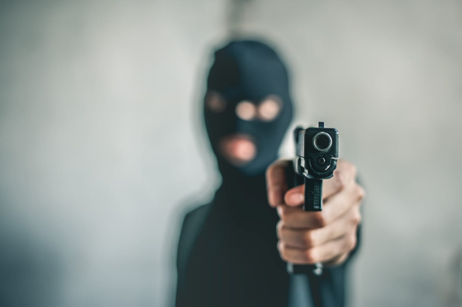 123rf gunman man with wearing mask gun shooting