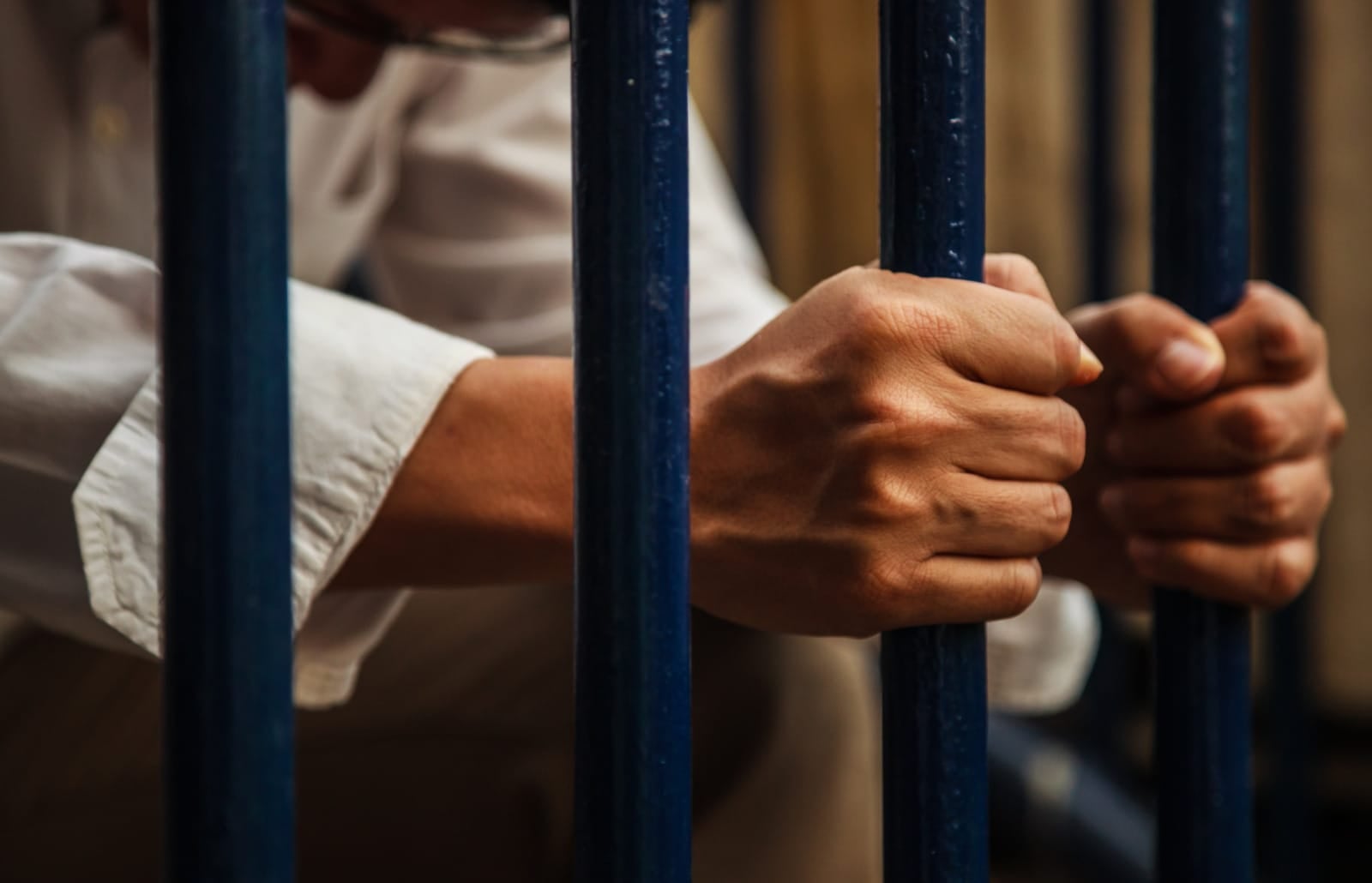123Rf Man Jailed Hands Holding Bars