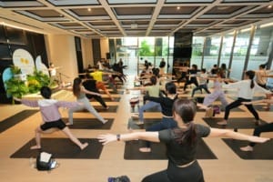 Jenn Chia a Certified Yoga Instructor leading a community yoga.jpg