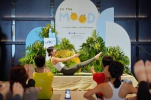 Jenn Chia a Certified Yoga Instructor striking a yoga pose