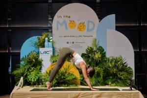 Jenn Chia a Certified Yoga Instructor striking a yoga pose at LAC Malaysias In The Mood with Jenn Chia Event 1