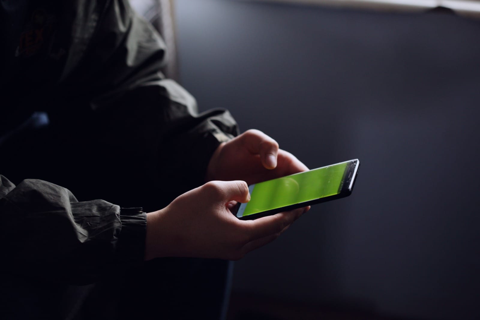 unsplash man holding mobile phone