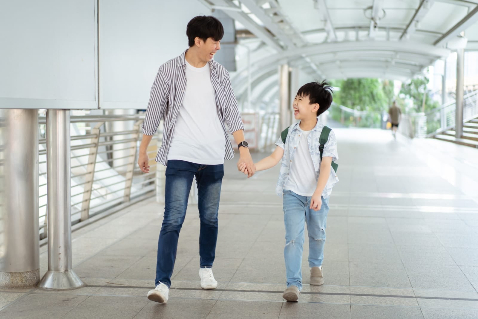 asian young dad walking son kid to school 123rf