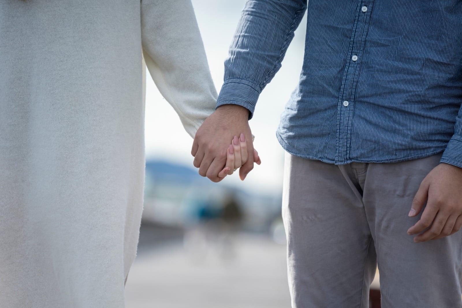 young couple holding hands long sleeve 123rf