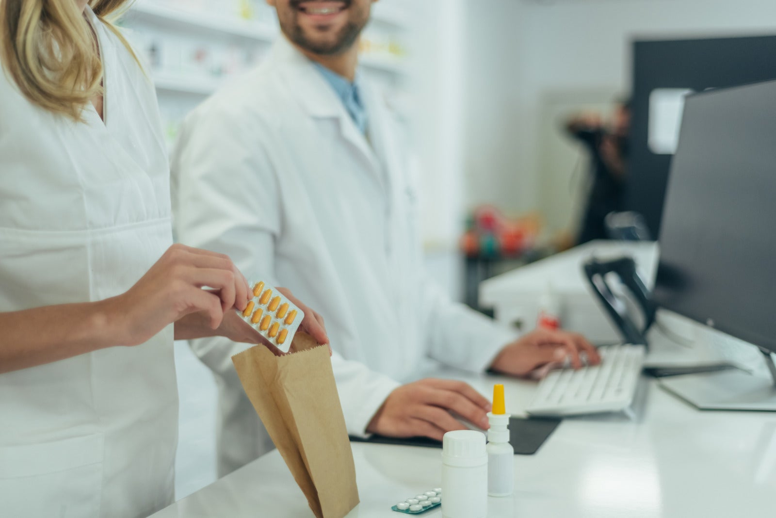 pharmacist working insert medicines into plastic paper bag pharmacy 123rf