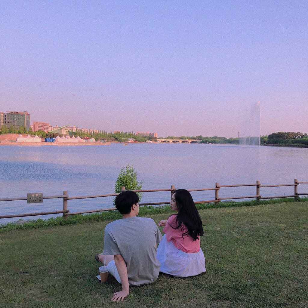 couple sitting beside lake korean ulzzang