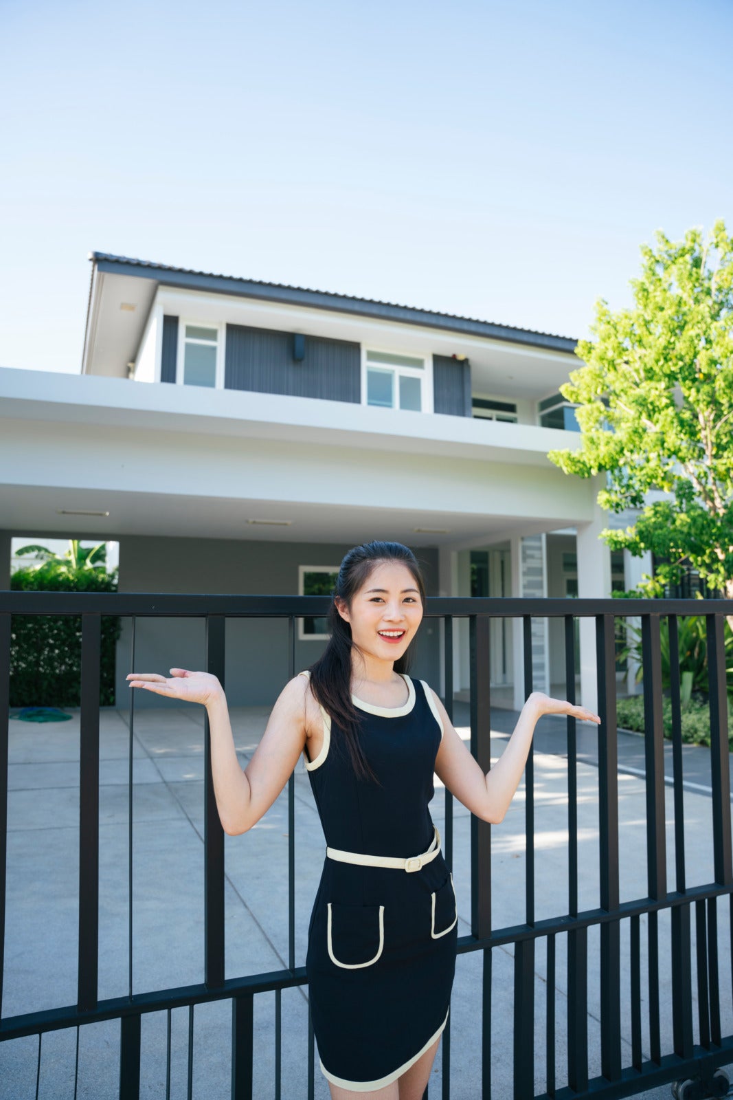 Woman In Black Dress Standing In Front Big New House 123Rf