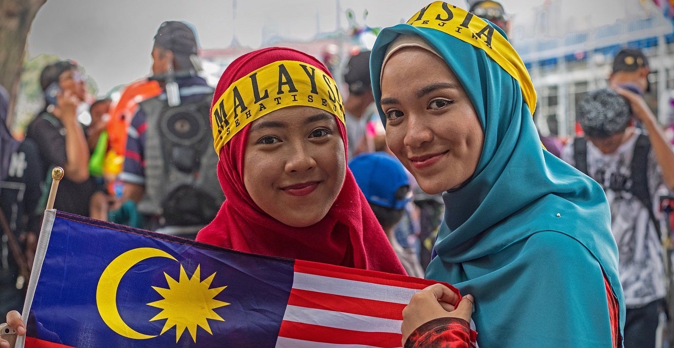 malaysian women holding flag