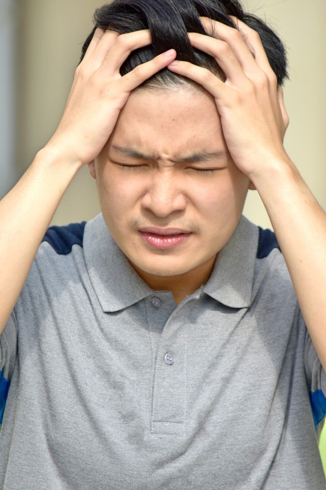 Asian Man Anxious Angry Headache 123Rf