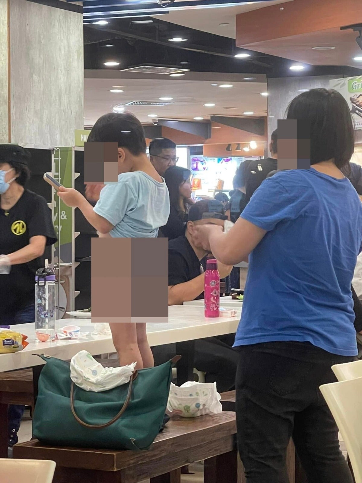 Mother Helps Kid Change Diaper In Kopitiam 2 1