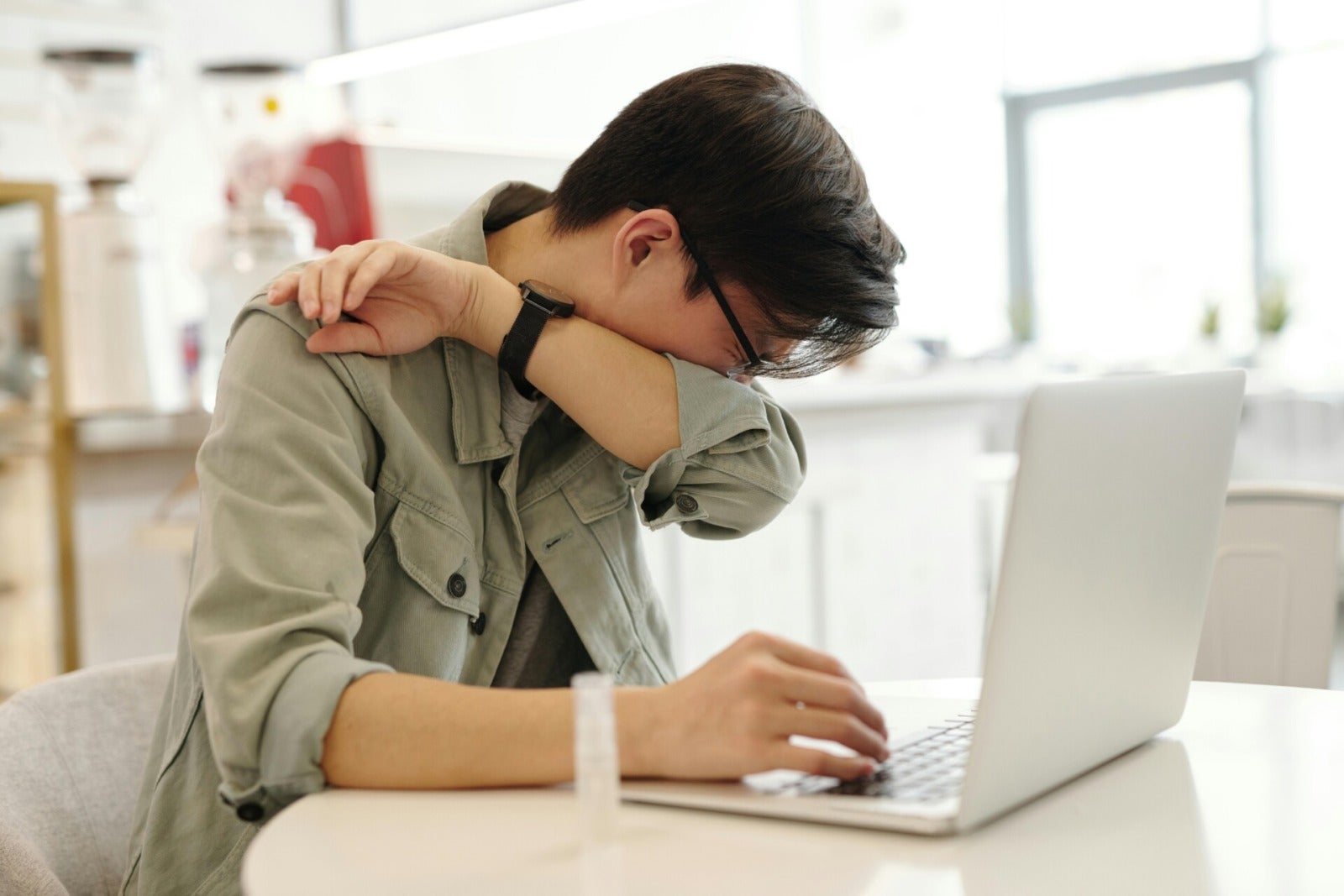 Pexels Edward Jenner Asian Man Using Laptop Working Tired Sick Cover Mouth