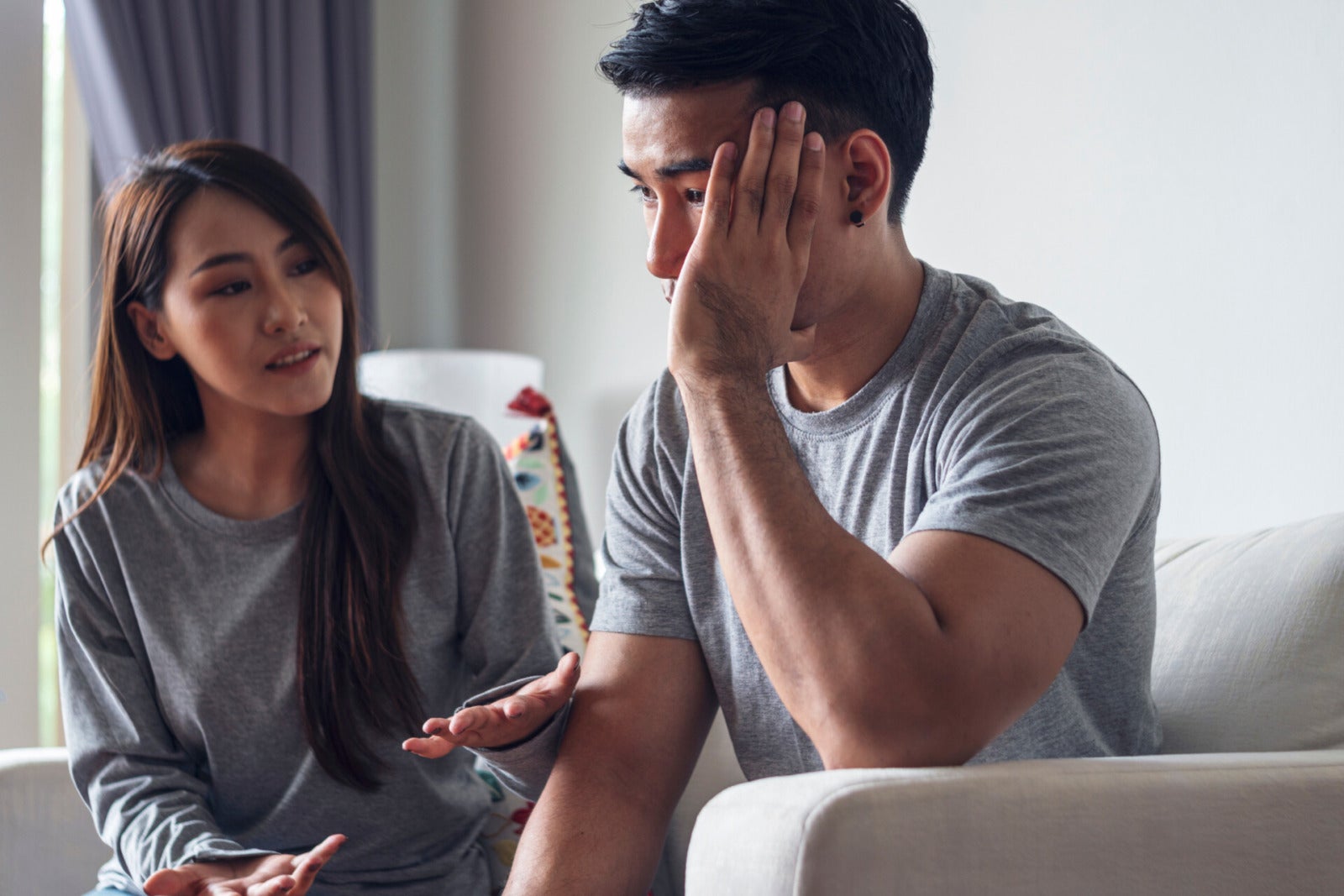 asian couple unhappy argue home living room 123rf