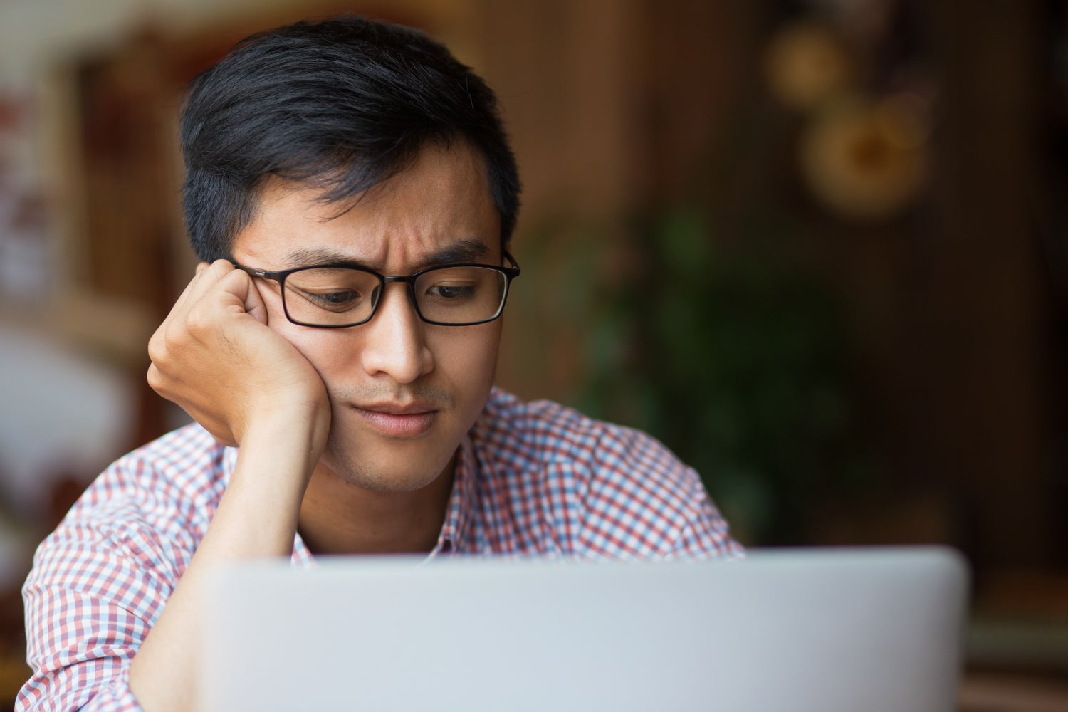 asian man confused computer freepik