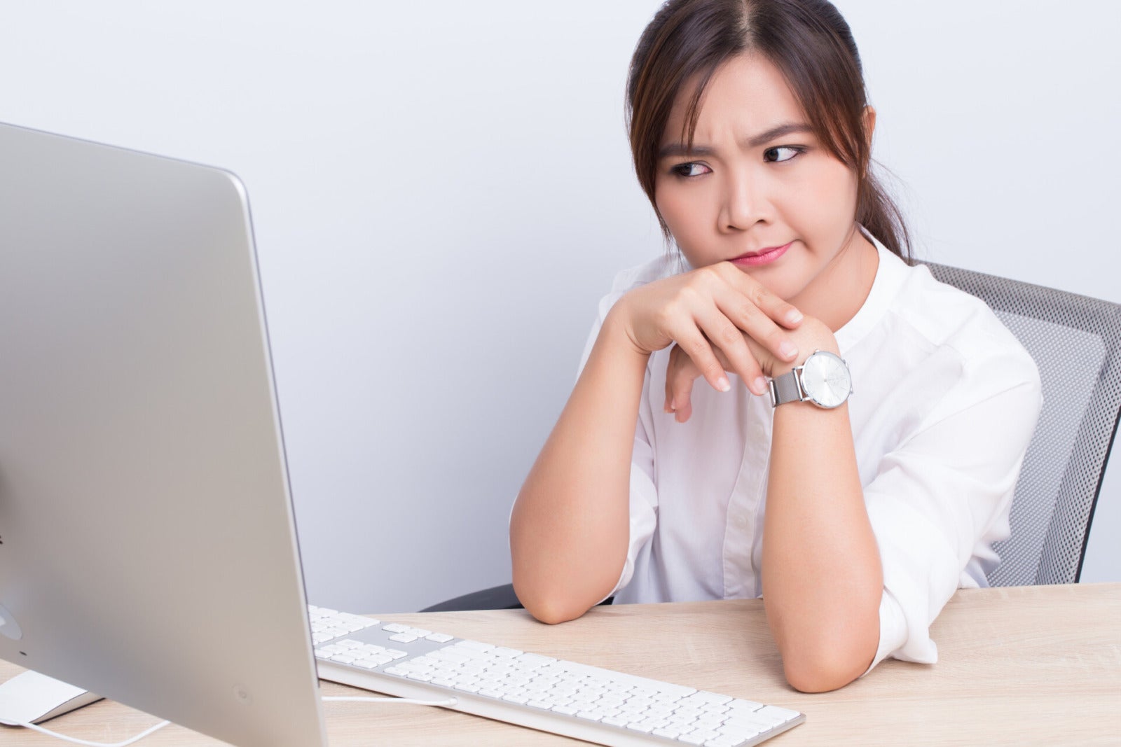 worker confused bored table asian woman 123rf